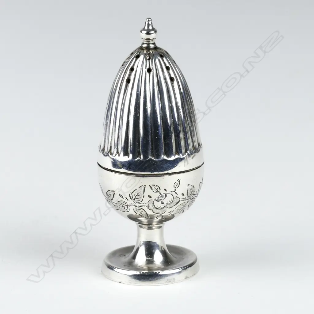 A small silver pepperette on stand Image 1++