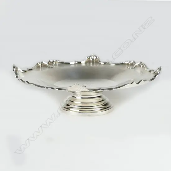 A silver dish on stand