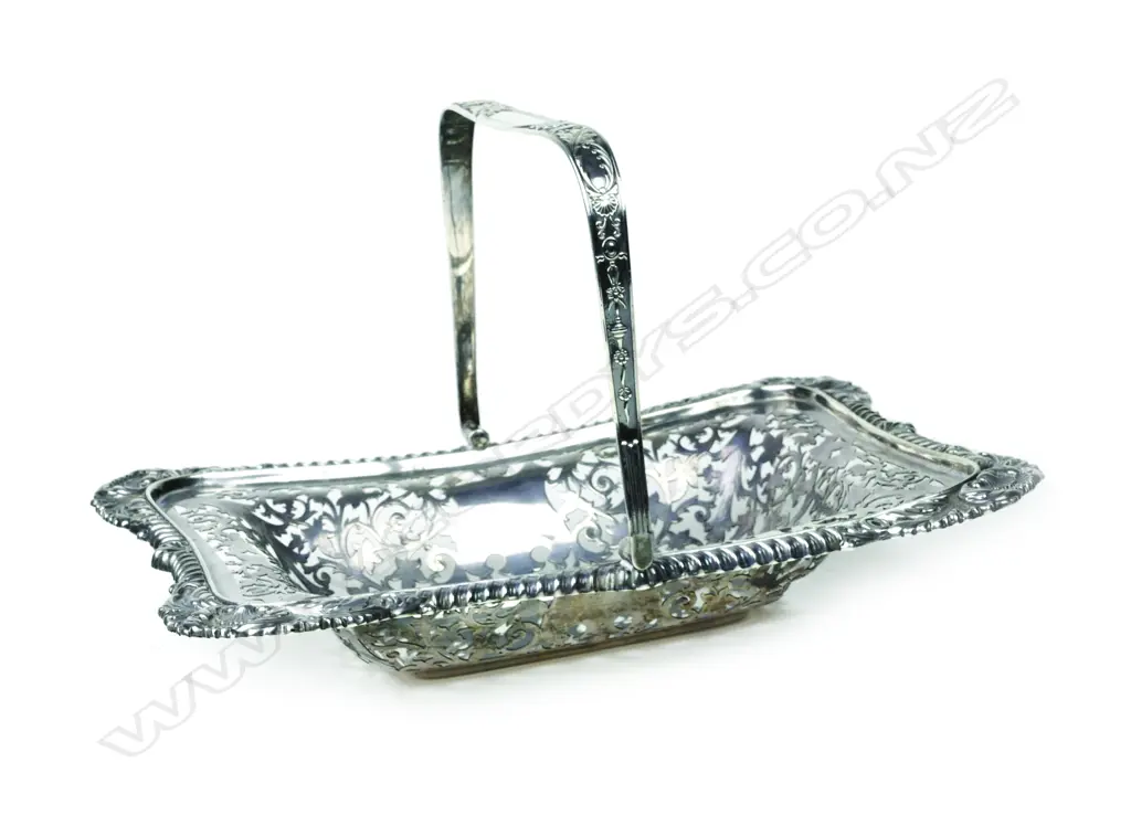 An early 20thC heavy silver swing handled decorative basket Image 1++