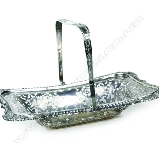 An early 20thC heavy silver swing handled decorative basket