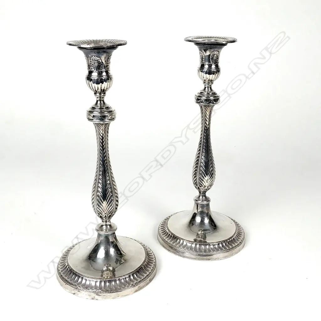 A pair of Victorian silver plate on copper candlesticks Image 1++