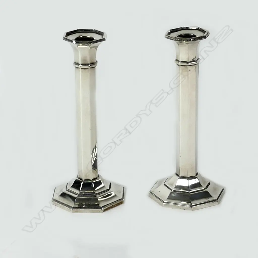 A pair of George V silver octagonal section column candlesticks Image 1++