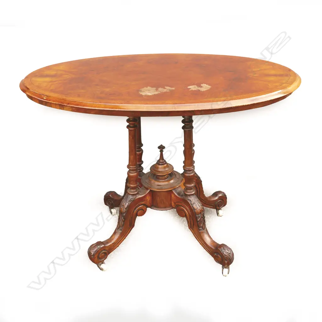 A Victorian walnut occasional table Image 1++