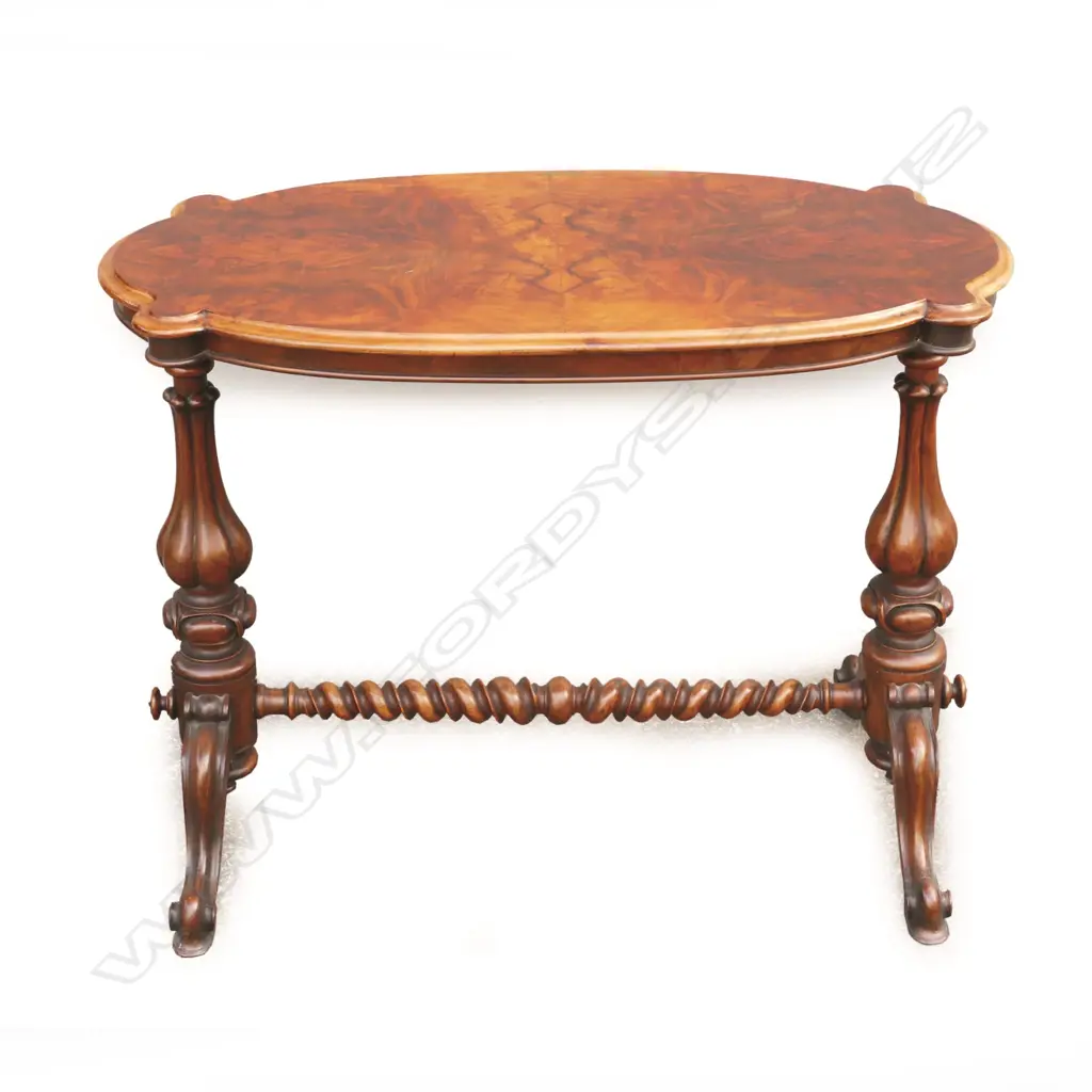 A Victorian walnut occasional table Image 1++