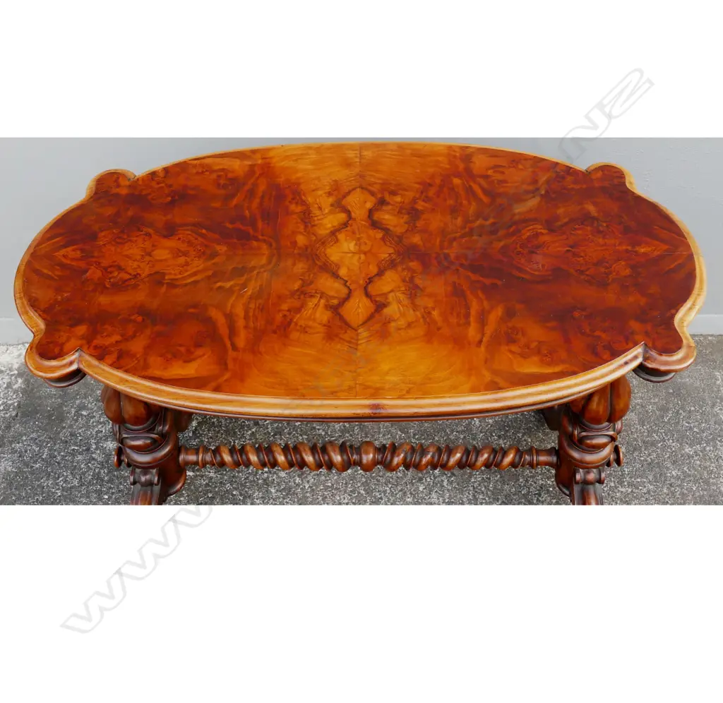A Victorian walnut occasional table Image 1++