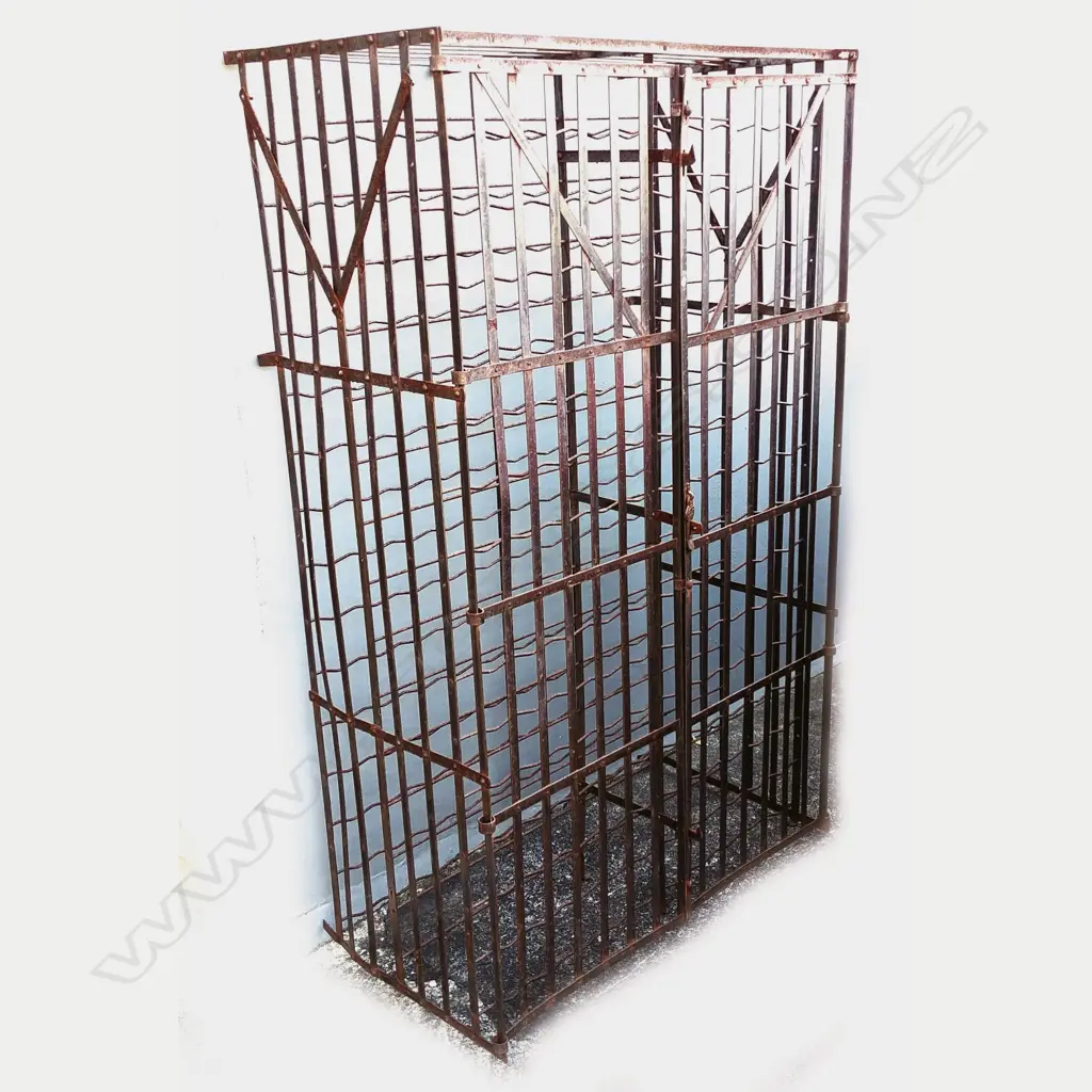 A large old iron wine rack of traditional cage design Image 1++
