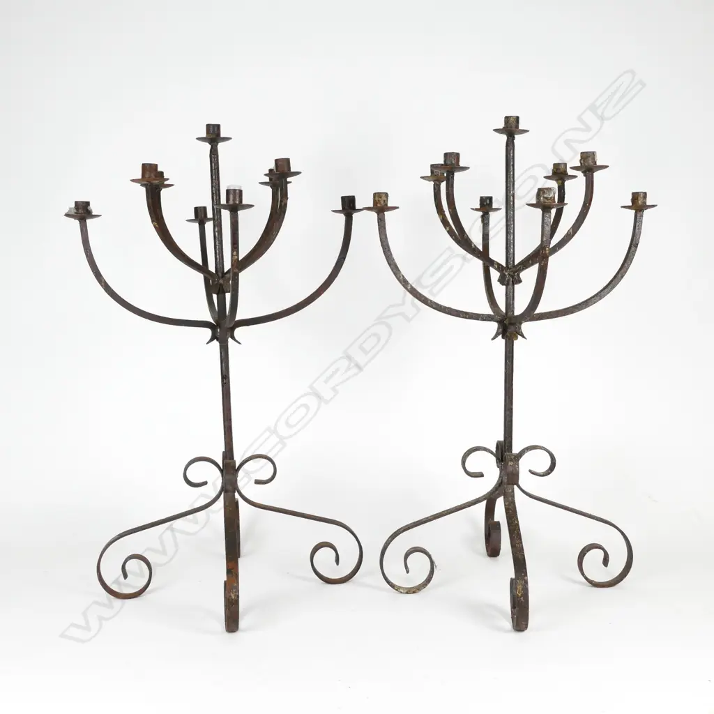 A pair of cast iron candelabra Image 1++