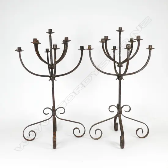 A pair of cast iron candelabra