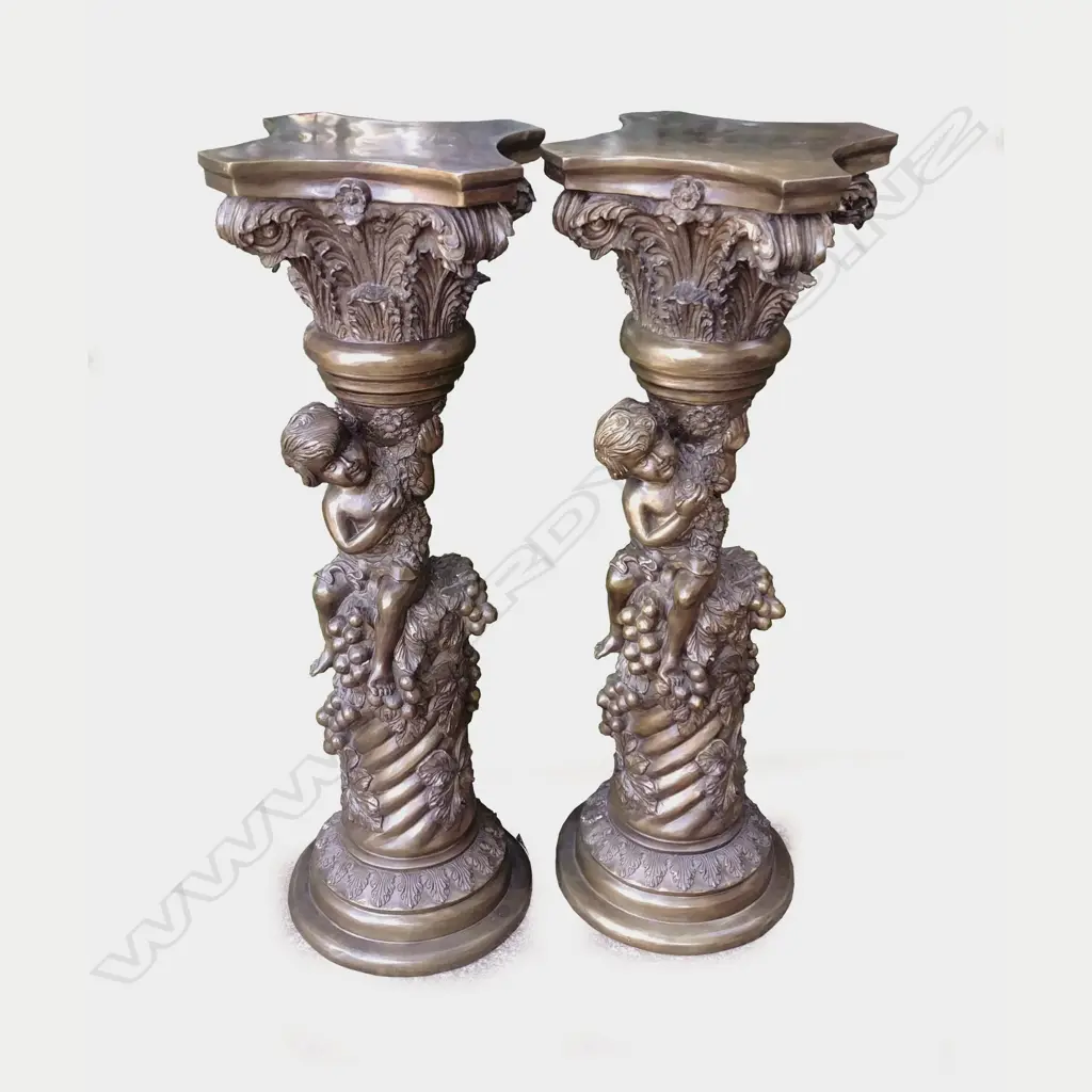 A matching pair of bronze stands with acanthus leaf plinth capitals Image 1++