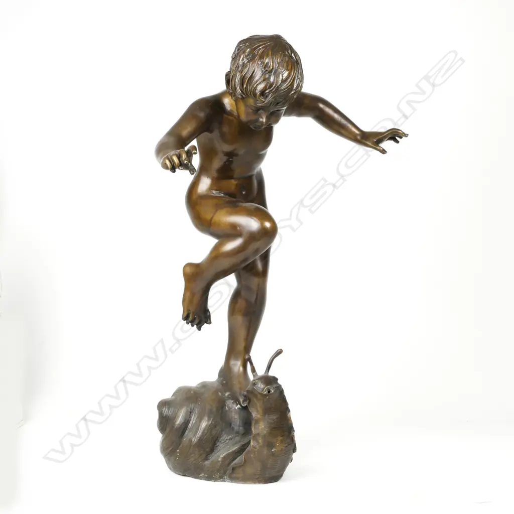 A bronze figure of a young naked dancing boy Image 1++