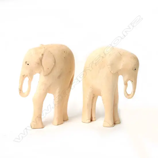 Two vintage African carved ivory elephants