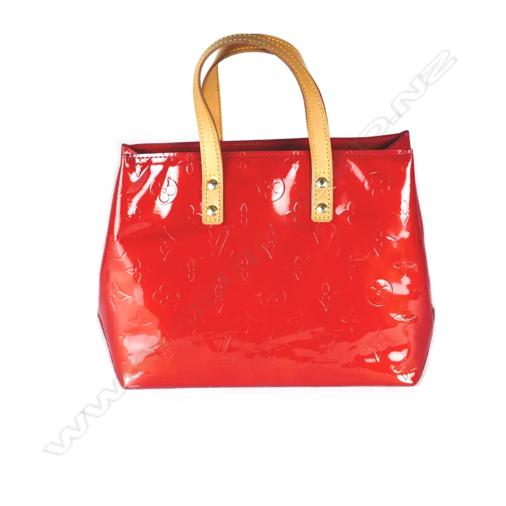 A Louis Vuitton monogram Vernis Reade handbag with Vachetta leather top handles and gold tone accents with authenticity code Image 1++