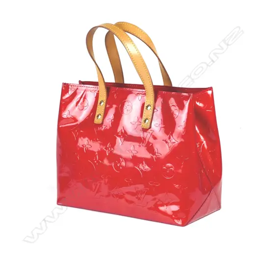 A Louis Vuitton monogram Vernis Reade handbag with Vachetta leather top handles and gold tone accents with authenticity code