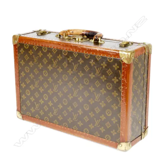 A vintage Louis Vuitton leather bound brass mounted attaché case