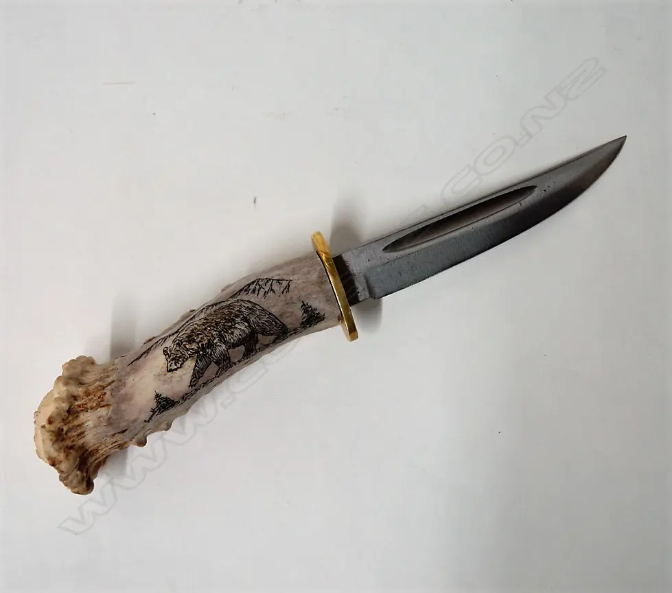 A Hubertus Solingen scrimshaw handled knife Image 1++