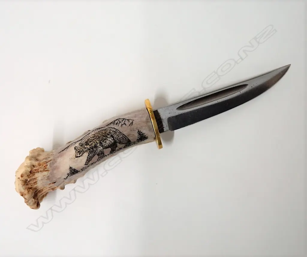 A Hubertus Solingen scrimshaw handled knife Image 1++