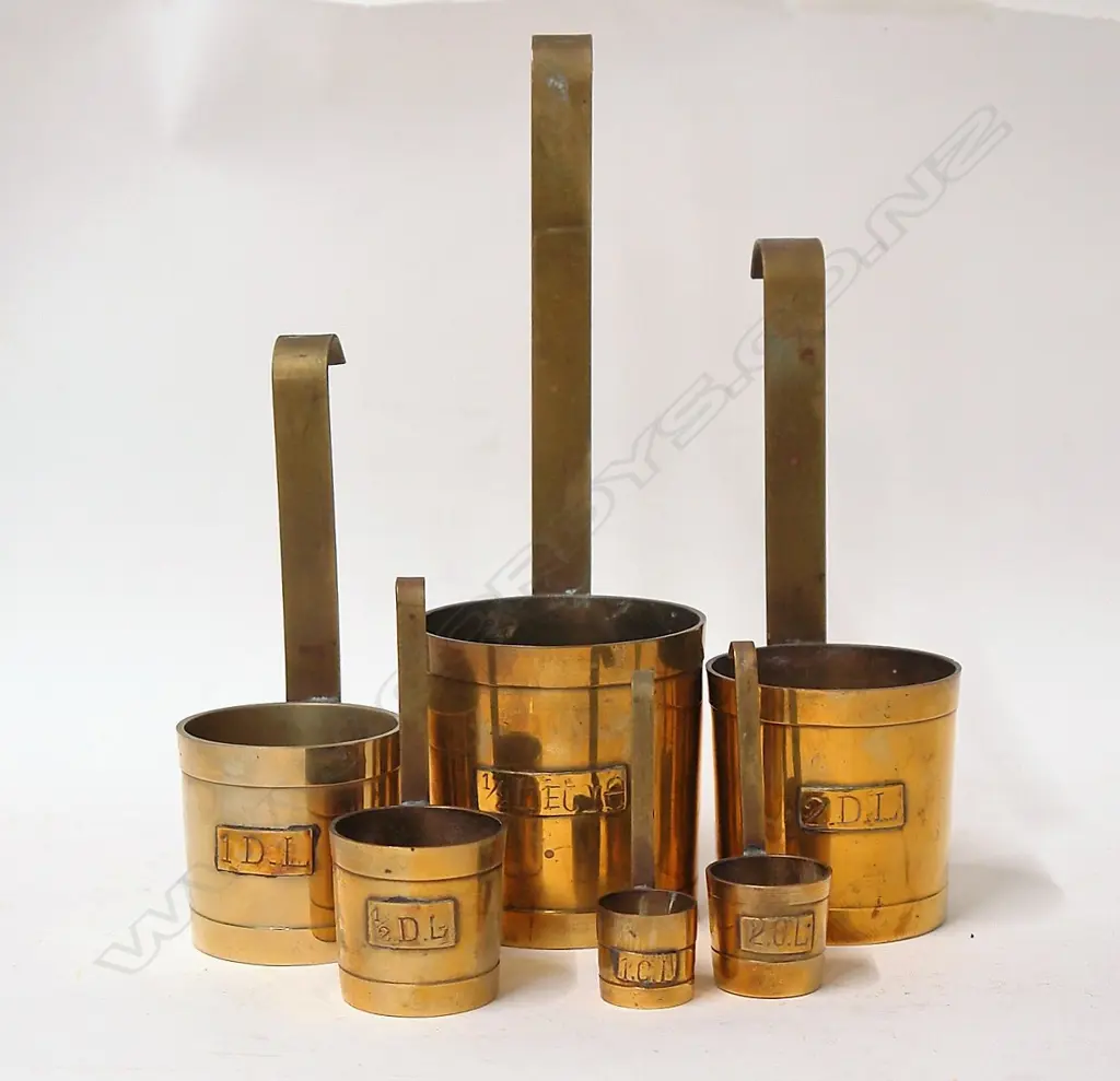 A set of six old European brass measures Image 1++