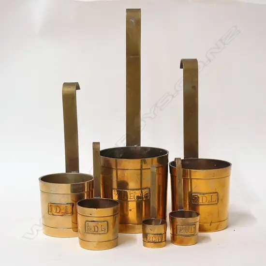 A set of six old European brass measures