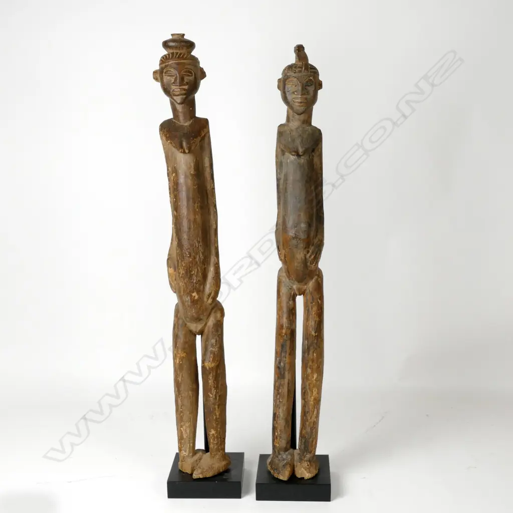 A pair of tall African cast wooden female figures Image 1++