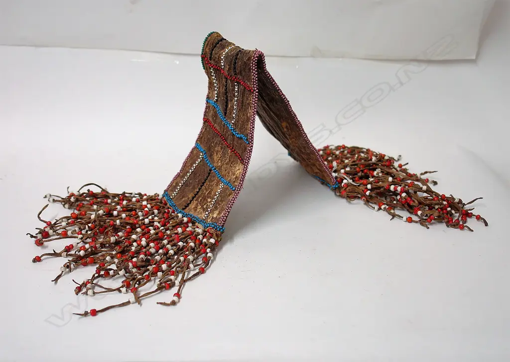 An old African leather and beaded belt type section Image 1++