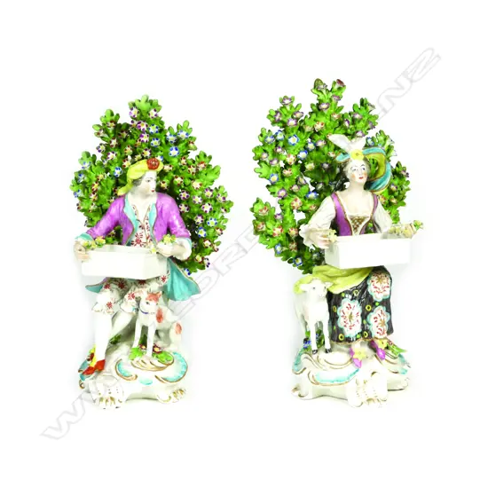 A pair of antique Chelsea type figurines