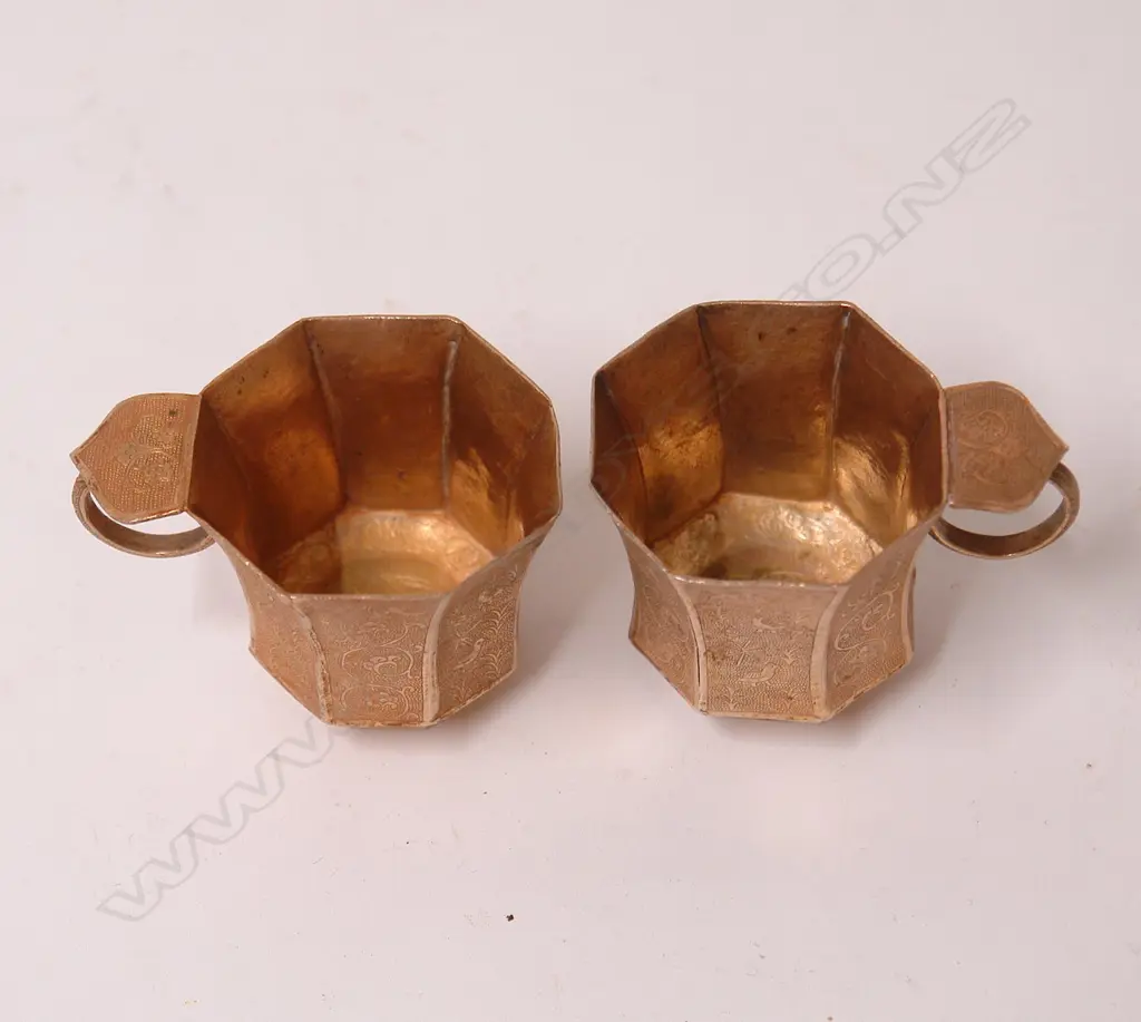 A pair of fine and old Chinese silver gilt Tang style cups Image 1++