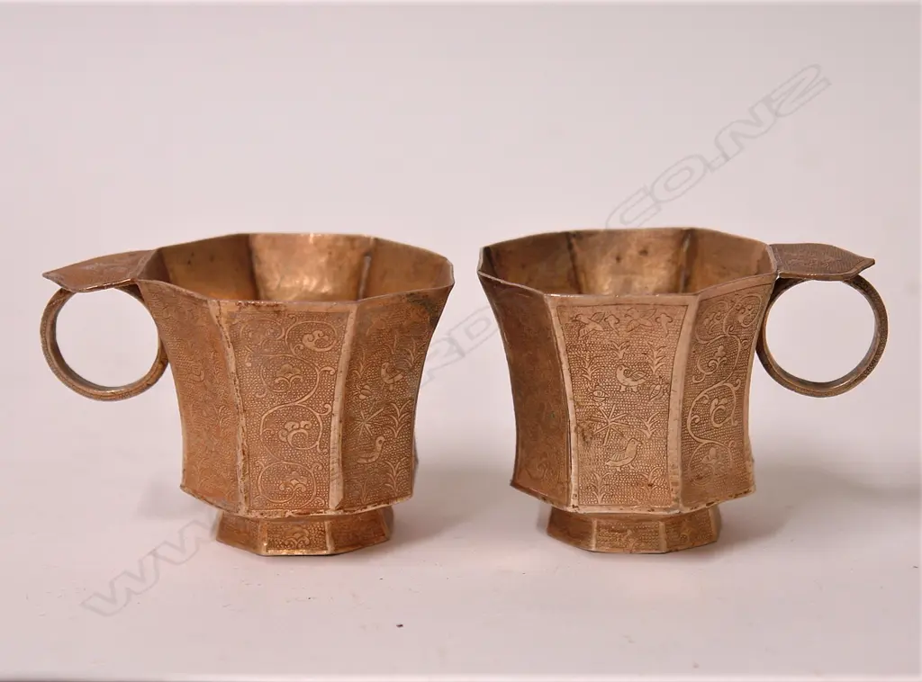 A pair of fine and old Chinese silver gilt Tang style cups Image 1++