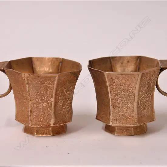 A pair of fine and old Chinese silver gilt Tang style cups