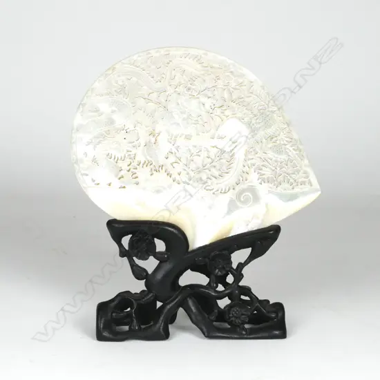 A mother-of-pearl shell on stand