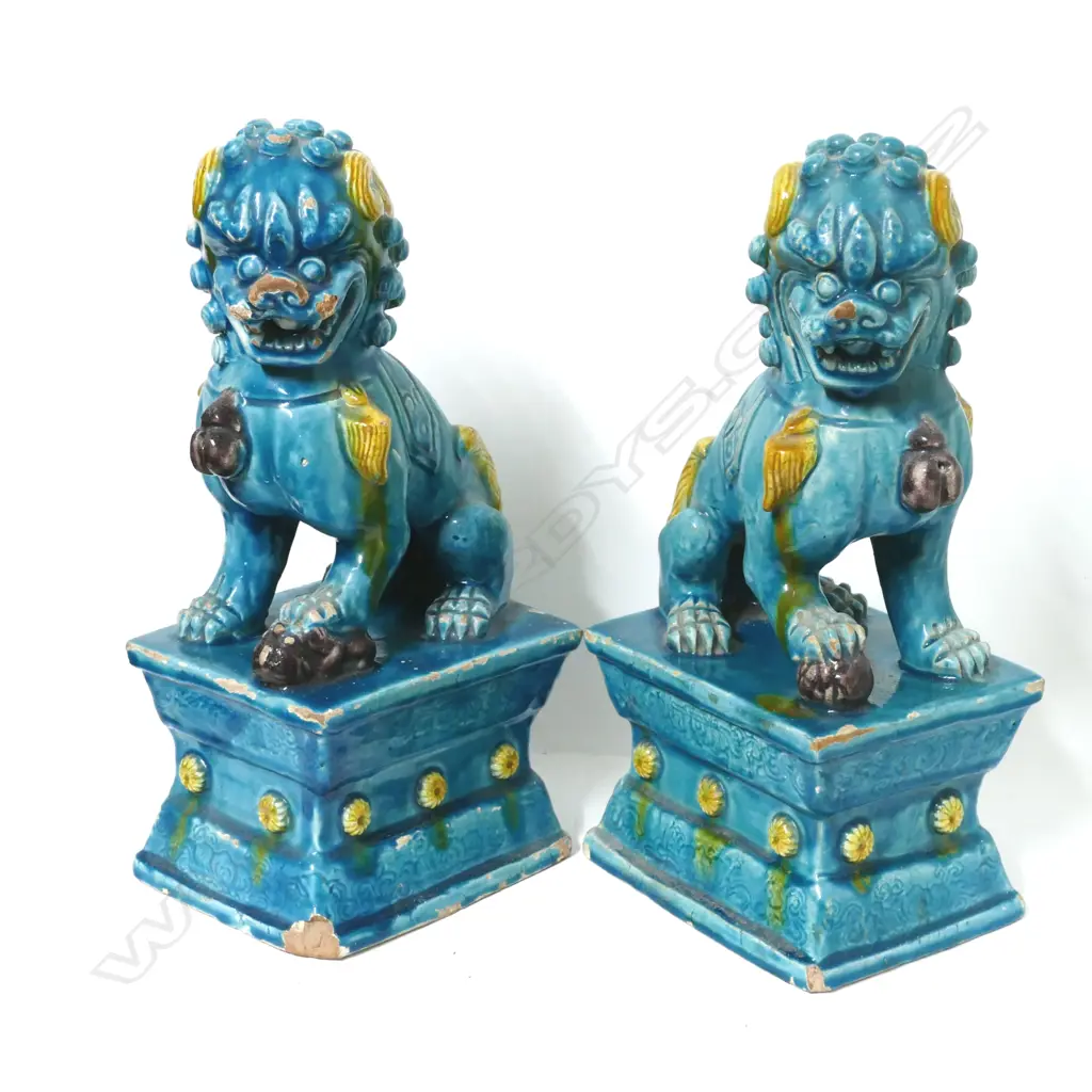 A pair of old Chinese glazed pottery kylins on plinth bases Image 1++