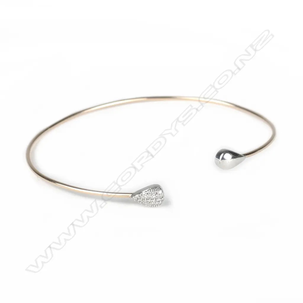 A 10ct. rose gold and diamond bangle Image 1++