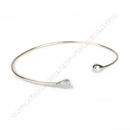 A 10ct. rose gold and diamond bangle