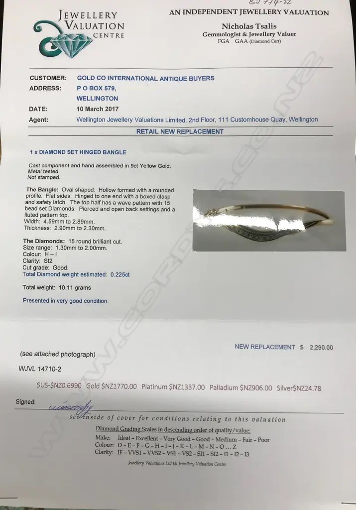 A vintage lady's 9ct. yellow gold and diamond hinged bangle Image 1++