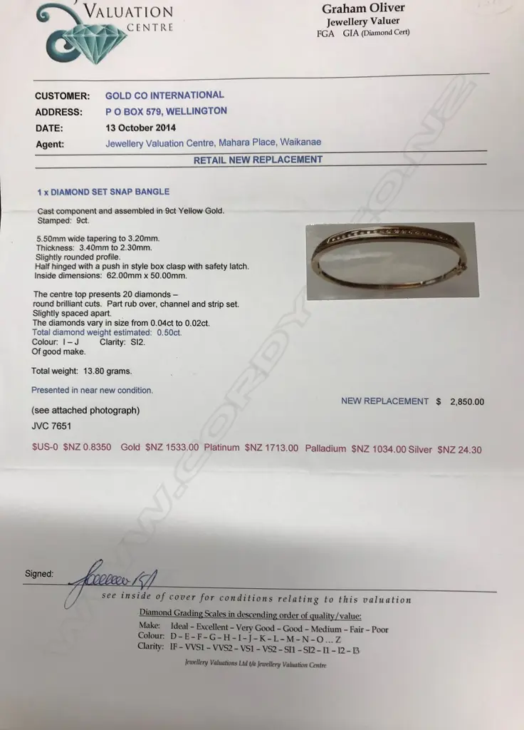 A modern 9ct. yellow gold and 20 diamond hinged snap bangle Image 1++