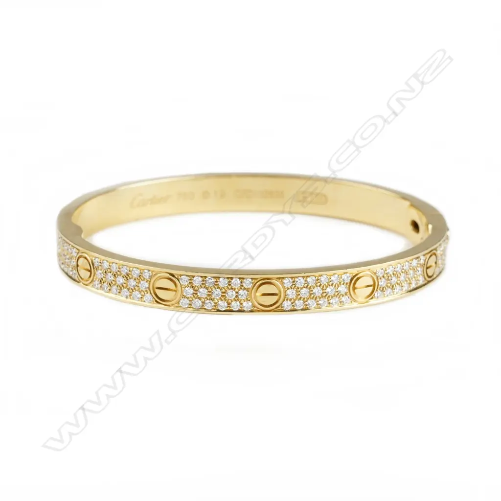 An 18ct. yellow gold and diamond Cartier bangle Image 1++