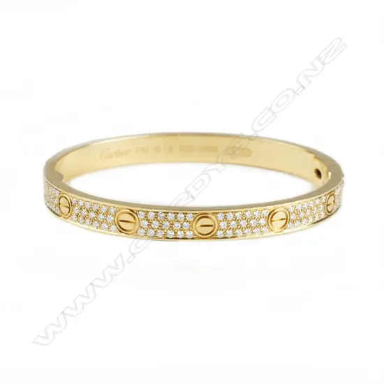 An 18ct. yellow gold and diamond Cartier bangle
