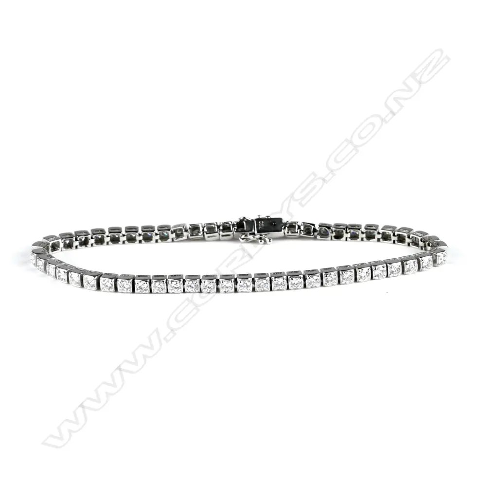 An 18ct. white gold and diamond tennis bracelet Image 1++