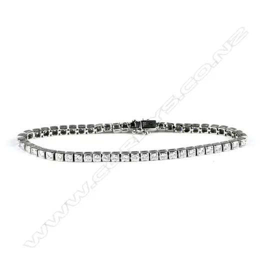 An 18ct. white gold and diamond tennis bracelet