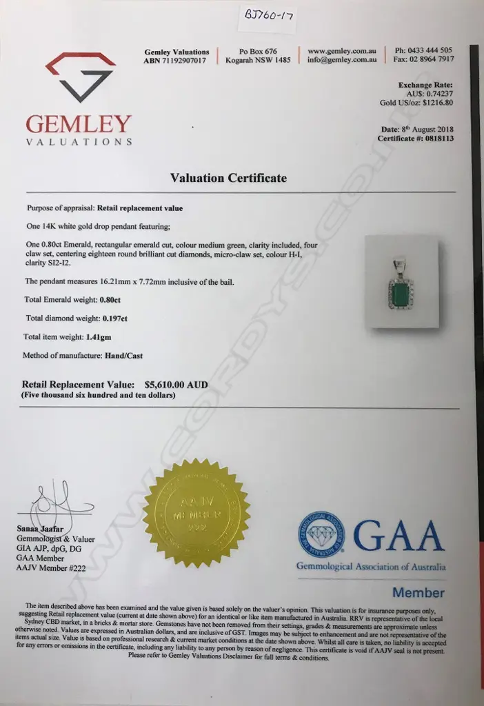 A 14ct. white gold emerald and diamond pendant Image 1++
