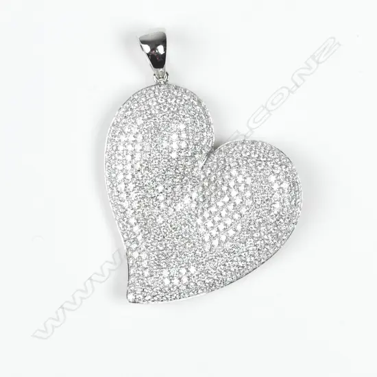 An 18ct. white gold diamond encrusted heart pendant