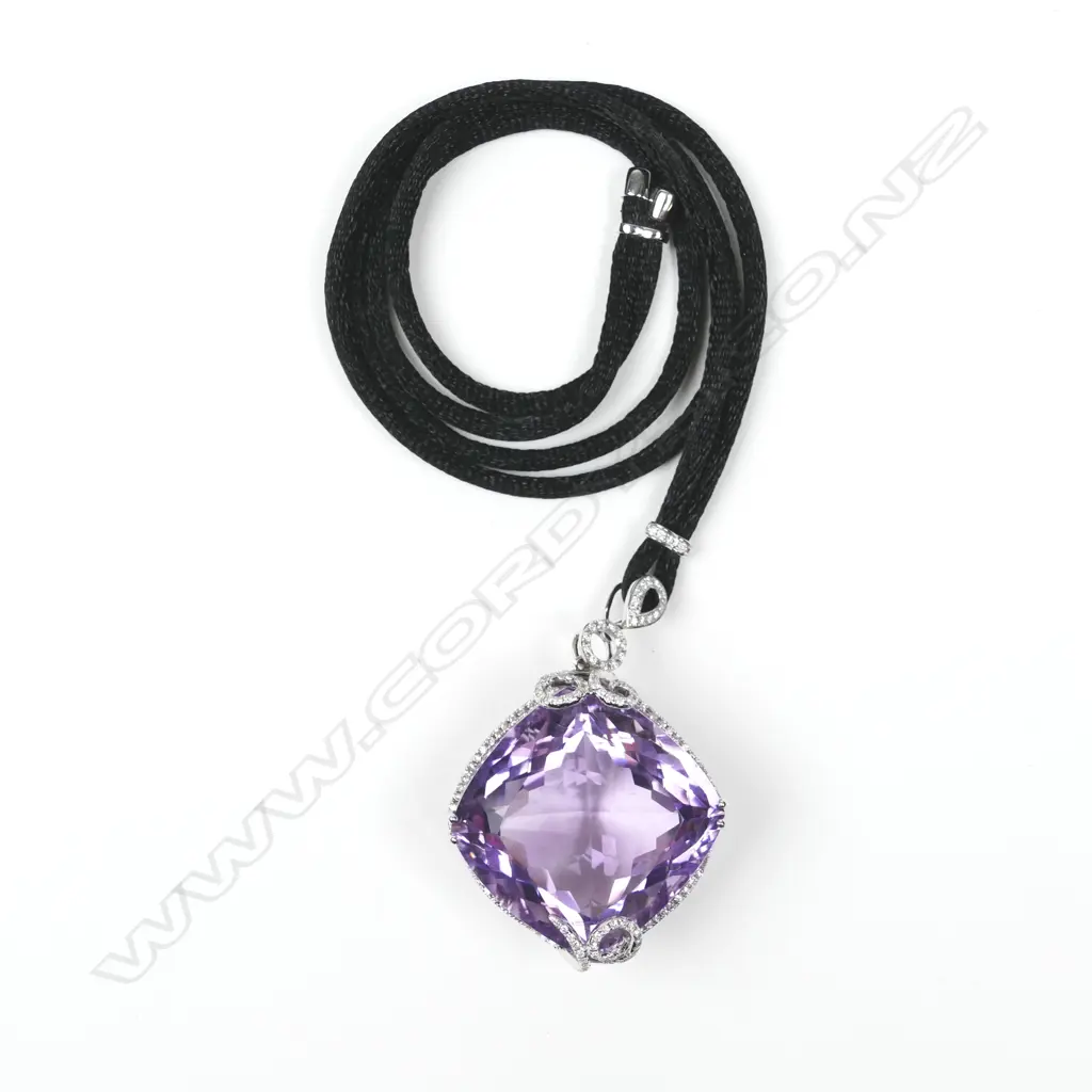 An impressive 18ct. white gold amethyst and diamond pendant Image 1++
