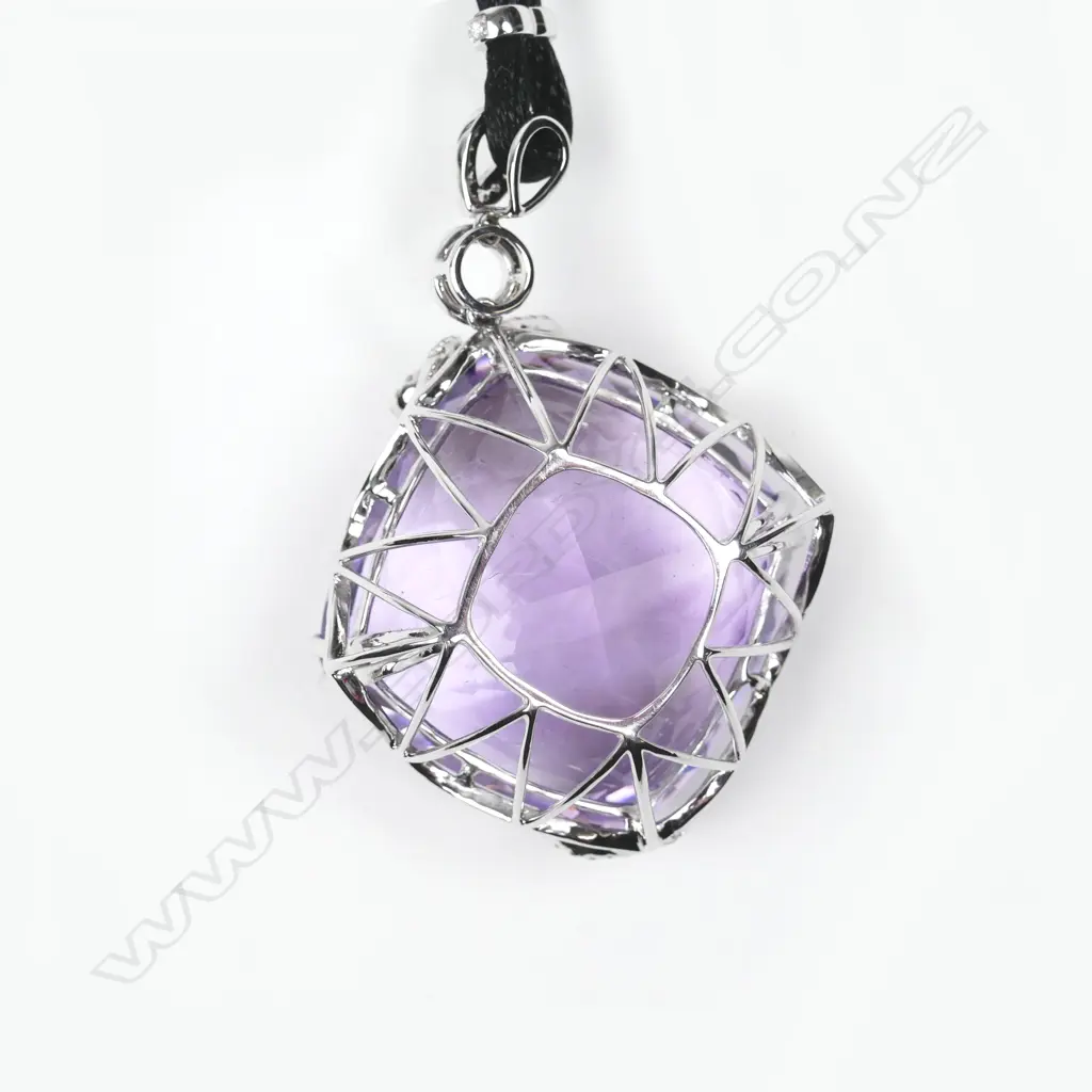 An impressive 18ct. white gold amethyst and diamond pendant Image 1++
