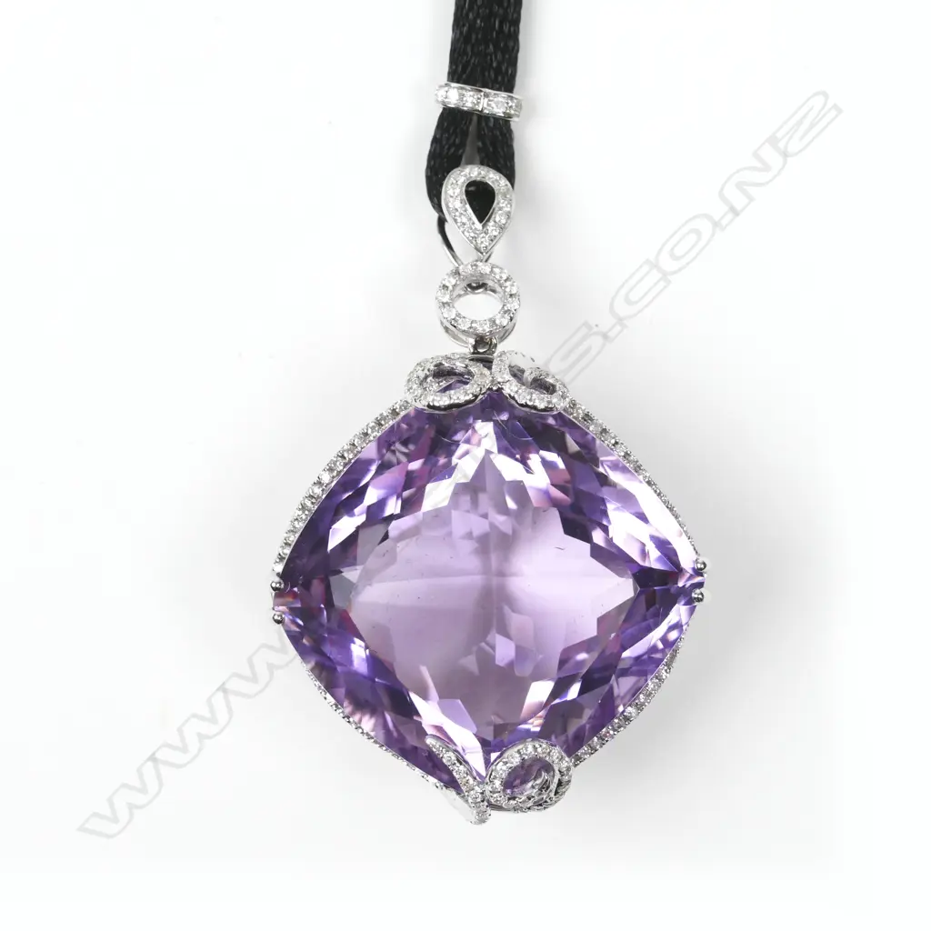 An impressive 18ct. white gold amethyst and diamond pendant Image 1++