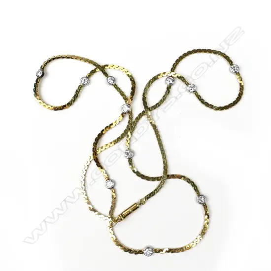 A vintage 14ct. yellow gold and 11 diamond set necklace