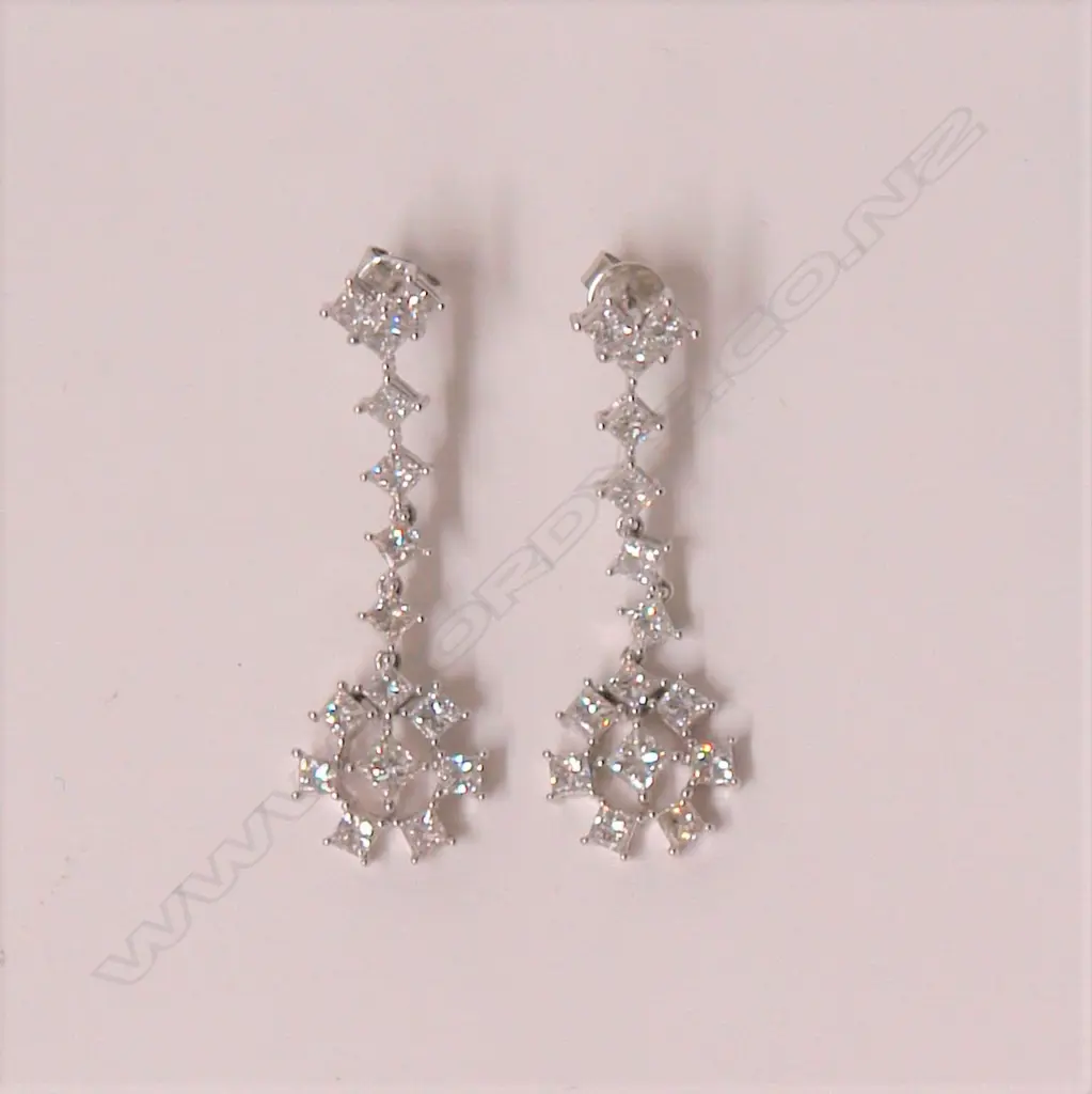 A pair of 18ct. white gold and diamond set drop earrings Image 1++