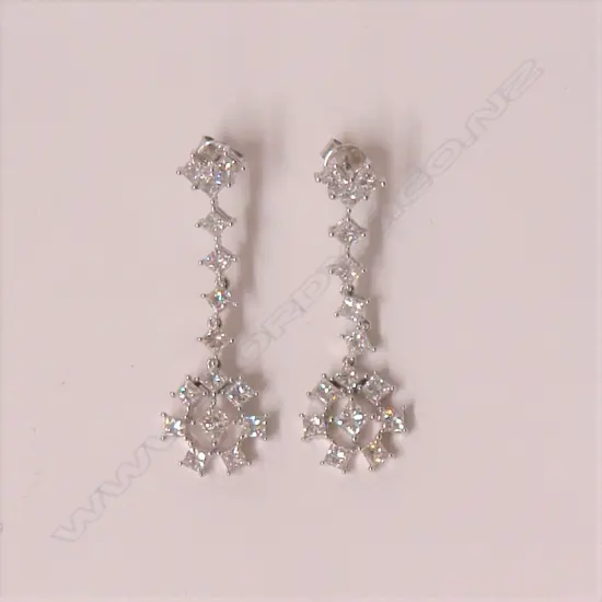 A pair of 18ct. white gold and diamond set drop earrings