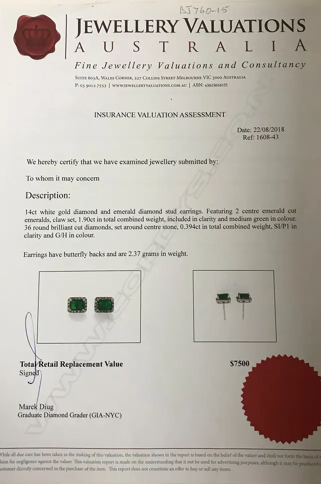 A pair of 14ct. white gold emerald and diamond stud earrings Image 1++