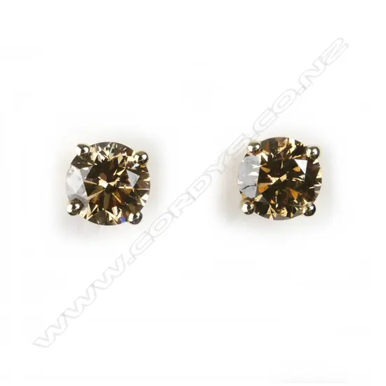 A pair of 14ct. gold and diamond stud earrings