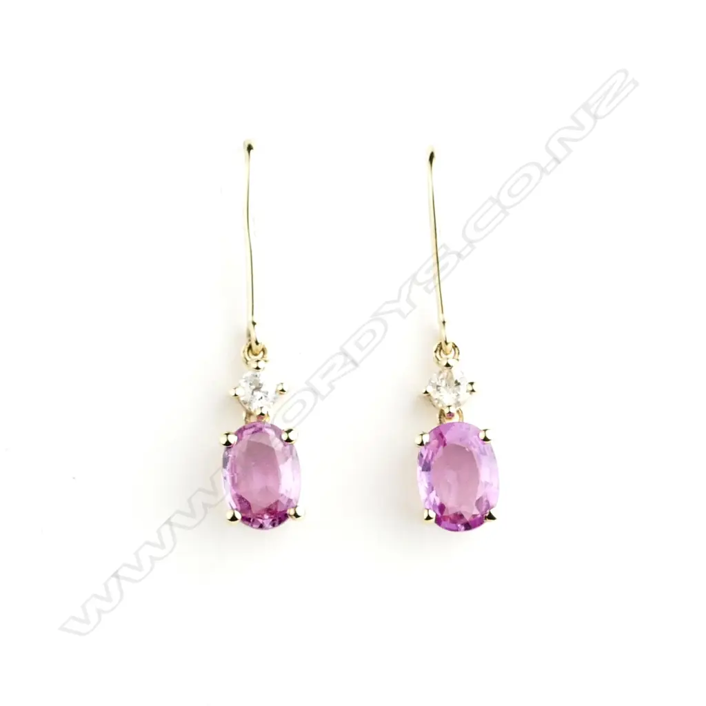 A pair of 14ct. gold sapphire and diamond earrings Image 1++