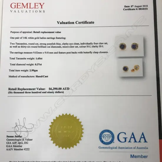 A pair of 14ct. gold tanzanite and diamond stud earrings